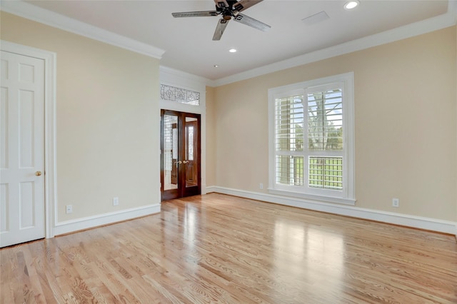 spare room with light wood-style flooring, ornamental molding, recessed lighting, baseboards, and ceiling fan