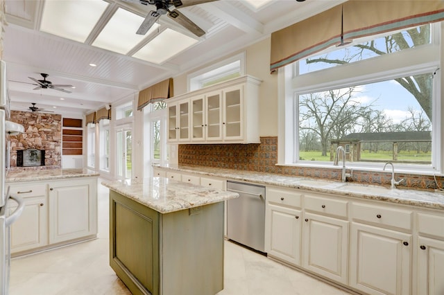 kitchen featuring dishwasher, a healthy amount of sunlight, and ceiling fan