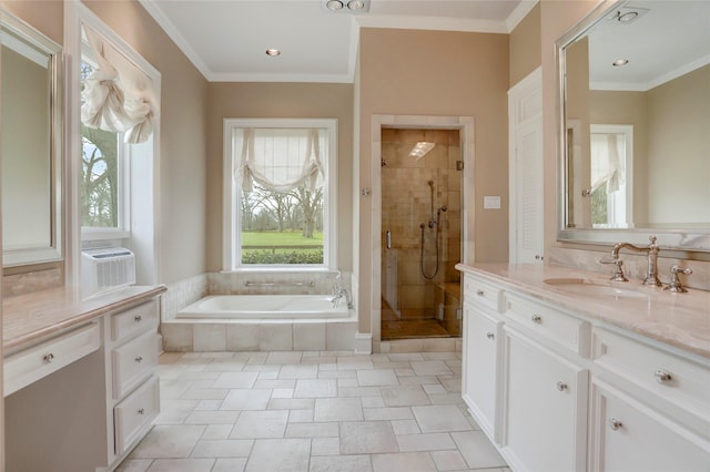 full bath featuring vanity, a garden tub, a shower stall, and crown molding