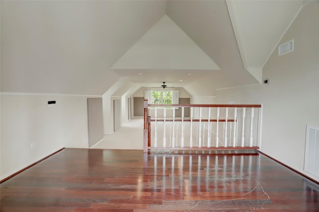 bonus room featuring visible vents, lofted ceiling, and wood finished floors