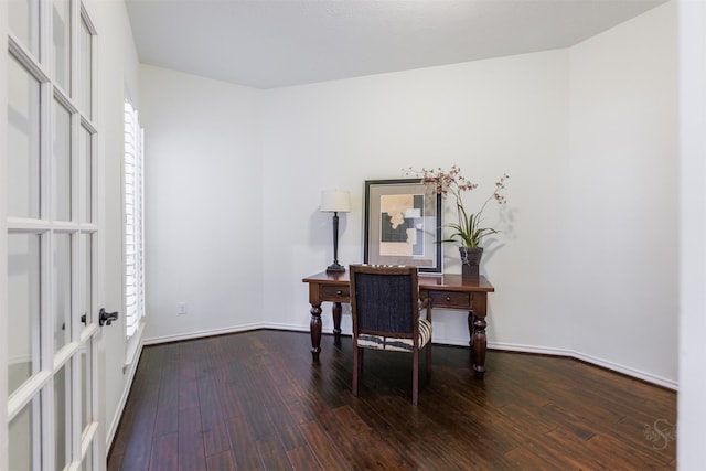 office space featuring baseboards and wood finished floors