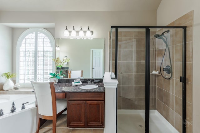 full bath featuring tile patterned floors, a stall shower, vanity, and a garden tub