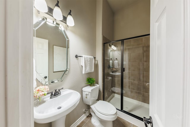 full bathroom with a sink, toilet, and a shower stall