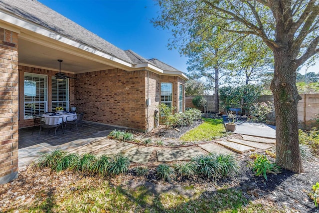 view of yard with a patio and fence