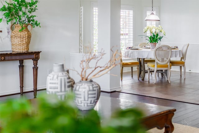 dining area featuring wood finished floors and baseboards