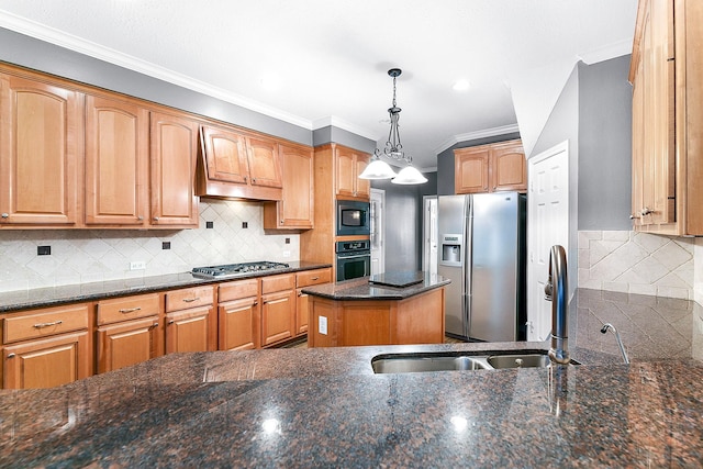 kitchen with dark stone countertops, a sink, appliances with stainless steel finishes, crown molding, and backsplash