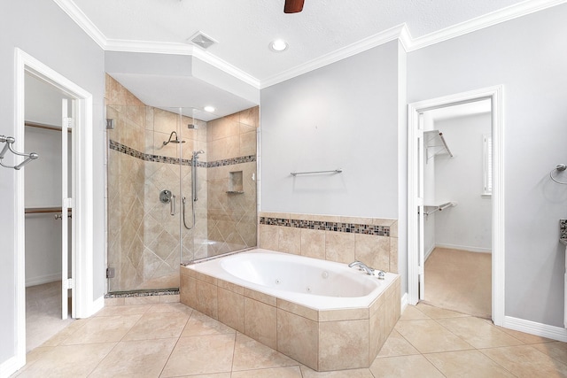 bathroom featuring a walk in closet, a tub with jets, ornamental molding, and a shower stall