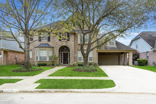 view of front of property featuring a front yard, an attached garage, brick siding, and driveway