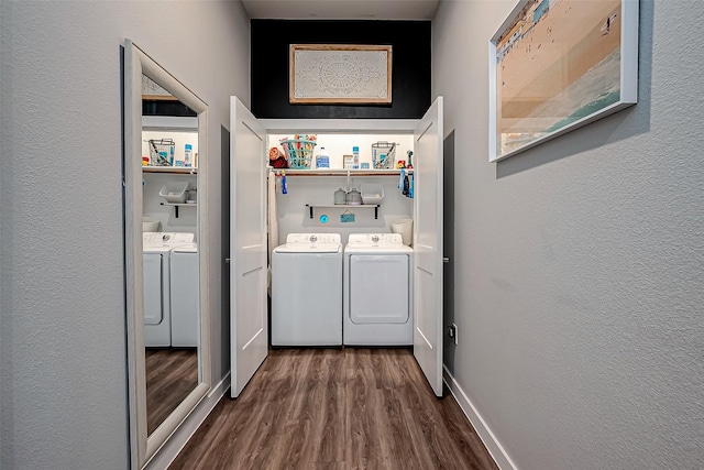 108 Bay Oaks Dr, La Porte, TX 77571 - washroom featuring a textured wall, dark wood-type flooring, laundry area, and washer and clothes dryer