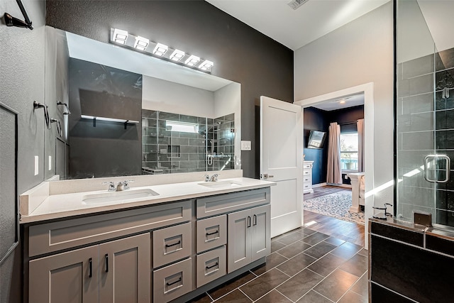 108 Bay Oaks Dr, La Porte, TX 77571 - full bath with double vanity, baseboards, a stall shower, and a sink