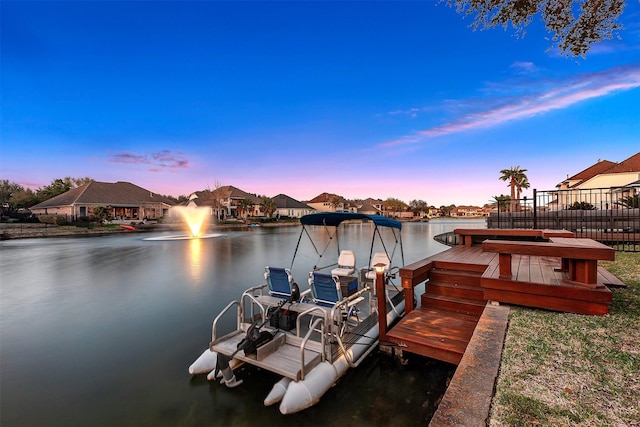 dock area featuring a water view