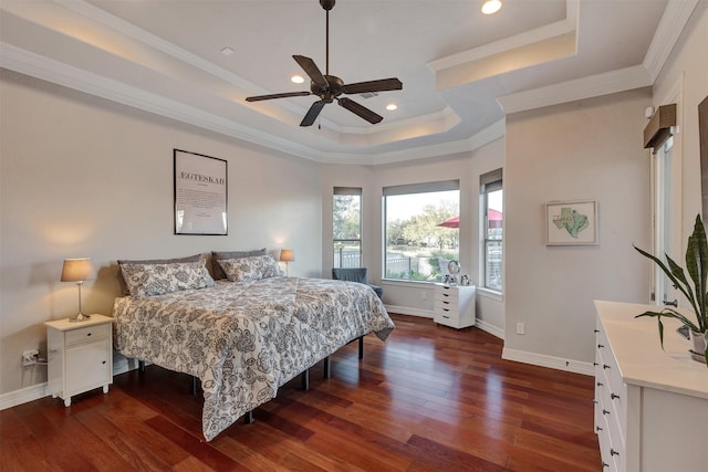 bedroom featuring crown molding, baseboards, a tray ceiling, recessed lighting, and dark wood-style flooring