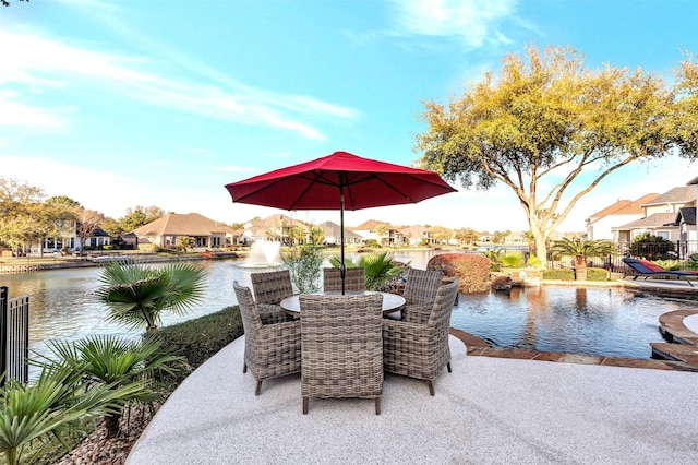 view of patio with a water view