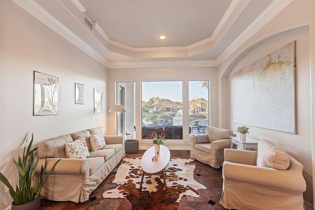 living area with visible vents, recessed lighting, a raised ceiling, and crown molding