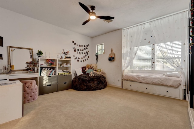 carpeted bedroom featuring ceiling fan