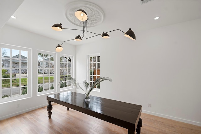 dining room featuring recessed lighting, baseboards, and light wood-style floors