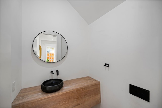 bathroom with lofted ceiling