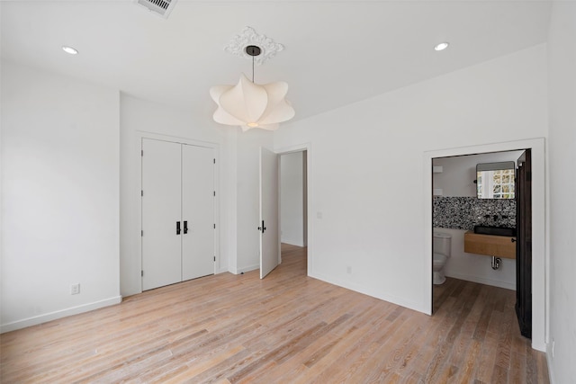 unfurnished bedroom with visible vents, recessed lighting, baseboards, and light wood-style floors