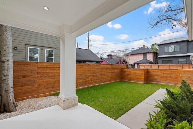 view of yard featuring a patio area and a fenced backyard