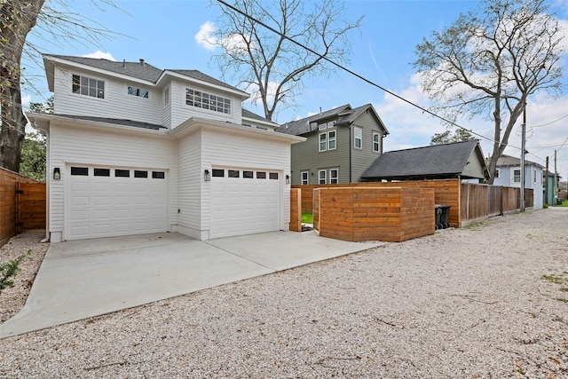 exterior space with fence and driveway