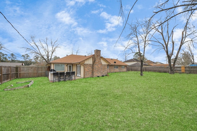 view of yard featuring a fenced backyard