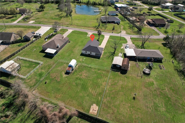 bird's eye view featuring a residential view and a water view