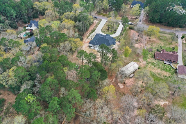 bird's eye view featuring a wooded view