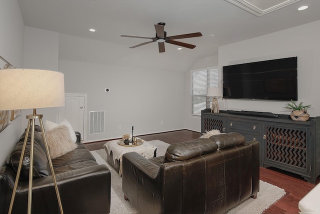 living area with recessed lighting, visible vents, wood finished floors, and vaulted ceiling