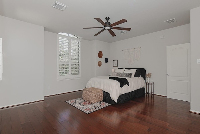 bedroom with visible vents, wood-type flooring, and ceiling fan