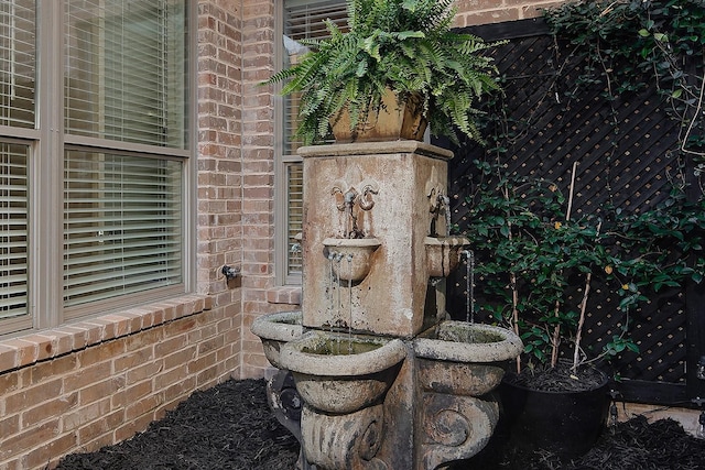 exterior details featuring brick siding