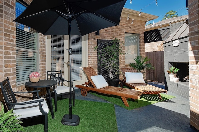 view of patio featuring fence