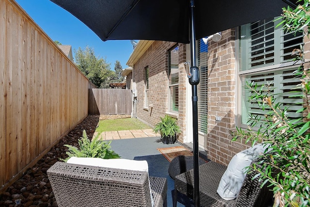 view of patio featuring a fenced backyard