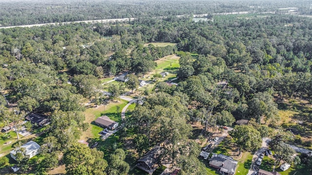 aerial view featuring a wooded view