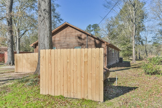 view of side of property featuring fence