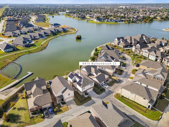 bird's eye view featuring a residential view and a water view