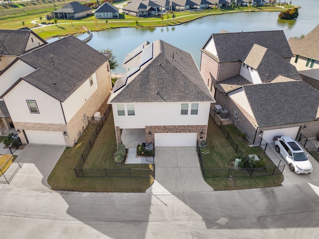 bird's eye view with a residential view and a water view