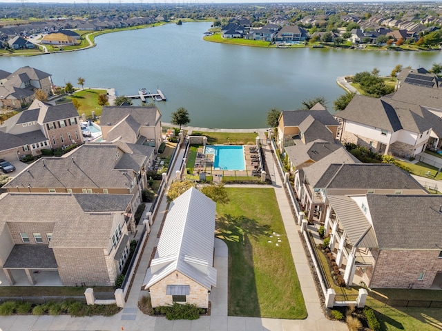 birds eye view of property featuring a residential view and a water view