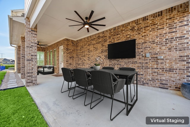 view of patio featuring outdoor dining space and a ceiling fan