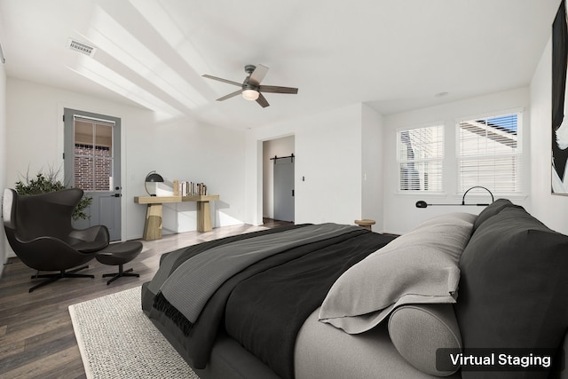 bedroom featuring a ceiling fan, dark wood-style floors, and visible vents