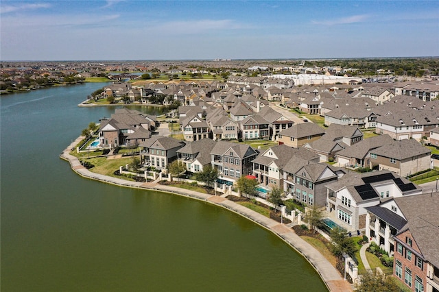 bird's eye view with a residential view and a water view