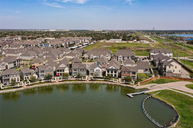 aerial view with a residential view and a water view