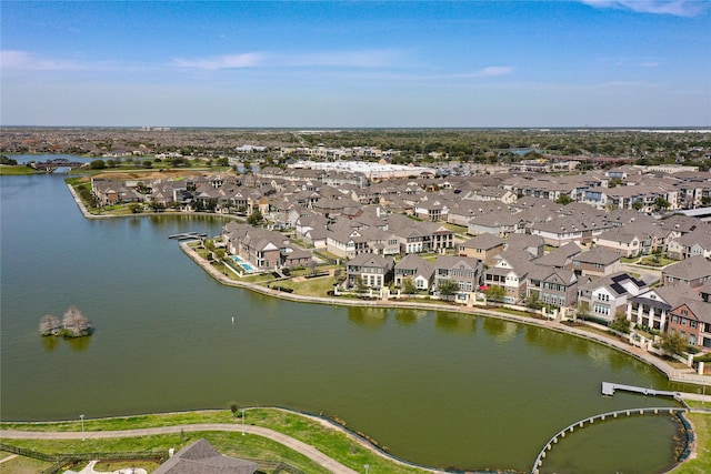 birds eye view of property with a residential view and a water view