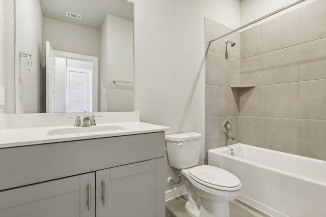 full bath with bathing tub / shower combination, visible vents, toilet, and vanity