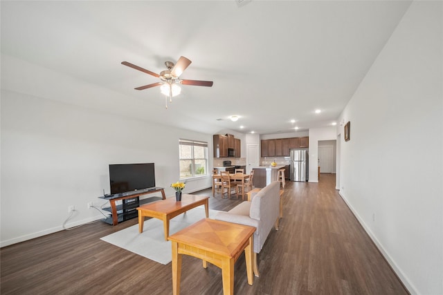 living area featuring recessed lighting, baseboards, ceiling fan, and dark wood-style flooring