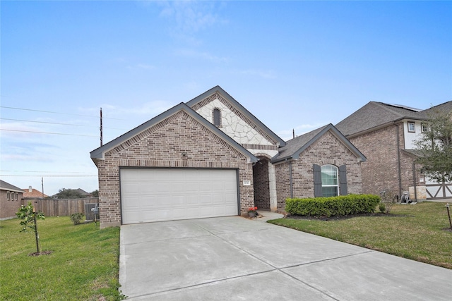 view of front facade featuring brick siding, a garage, a front lawn, and fence