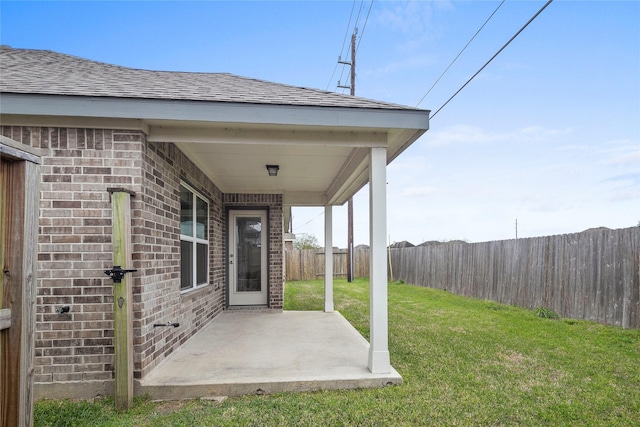 view of yard featuring a patio and fence