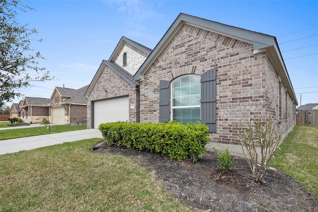 french country style house featuring concrete driveway, an attached garage, brick siding, and a front lawn