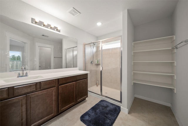 full bathroom featuring a wealth of natural light, visible vents, tile patterned flooring, and a stall shower