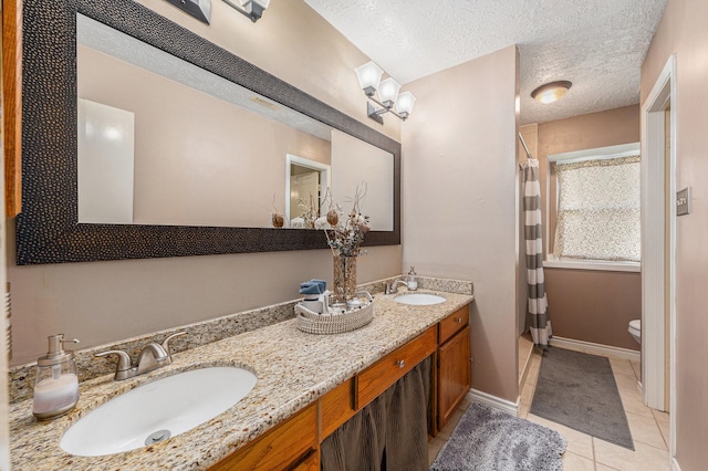 13930 Bonnercrest Dr, Houston, TX 77083 - full bathroom featuring toilet, tile patterned flooring, double vanity, a textured ceiling, and a shower with curtain