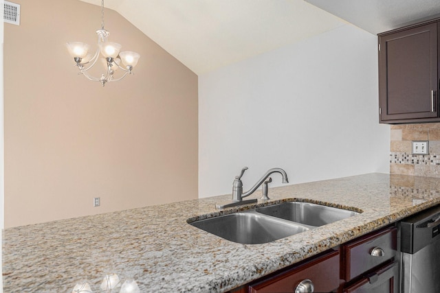 13930 Bonnercrest Dr, Houston, TX 77083 - kitchen with a sink, dishwasher, pendant lighting, vaulted ceiling, and light stone countertops